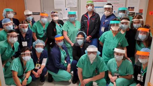 Group photo of healthcare workers wearing 3D-printed face shields