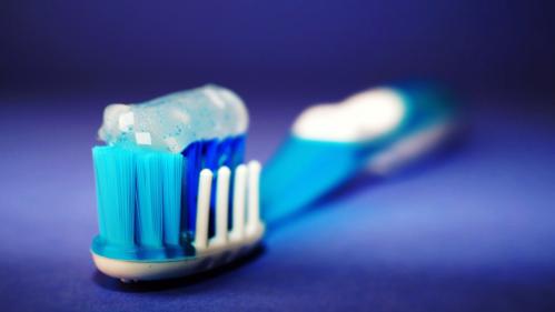 Blue and white toothbrush with gel toothpaste