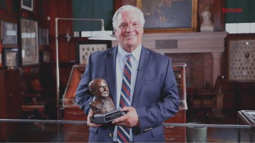 Michael Dunn holding Edison Patent Award