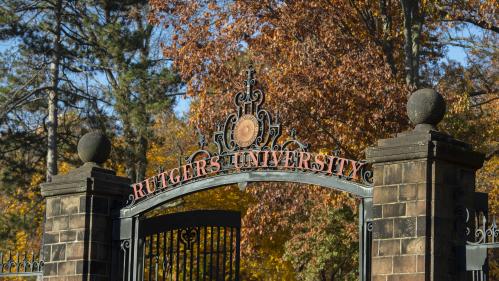 Rutgers University sign over gated doors