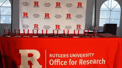 Rutgers Innovation Awards plaques on a table