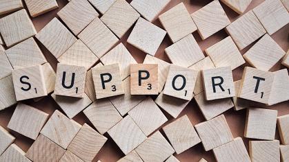 The word "support" in Scrabble letters across the image