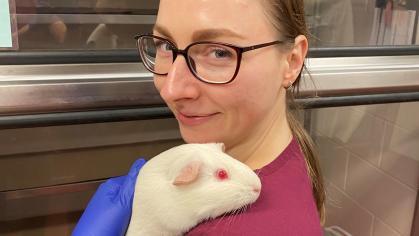 Veterinary Lab Staff holding a rabbit