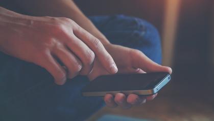 Image of someone holding a phone