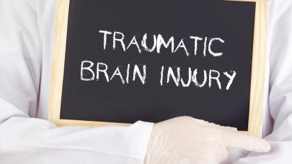 sign with words "traumatic brain injury"
