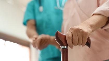 Person holding on to cane