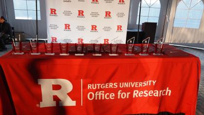 Image of a table with the Rutgers Innovation Awards on top from the 2024 RIA Banquet