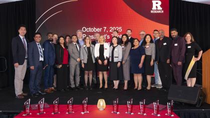Rutgers Office for Research team members tanding on the stage at the 2025 Rutgers Innovation Awards ceremony