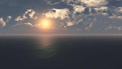 ocean with a blue sky and clouds