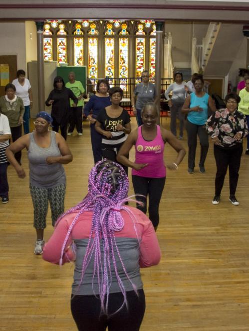African American women exercising together
