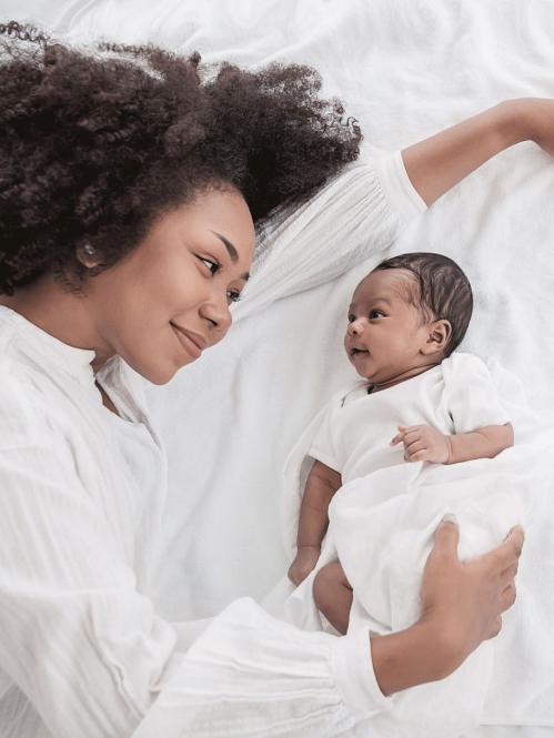 Mother and baby looking at each other.