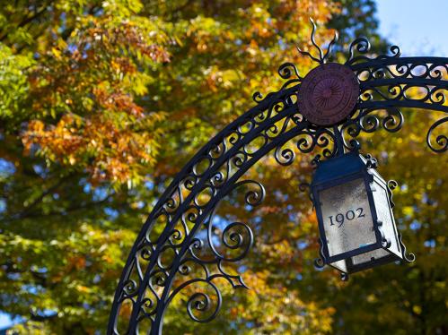 Fall view of the Class of 1902 gate on the Old Queens campus