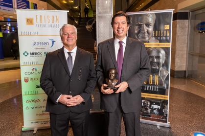 Photo of Drs. Dunn and Gatt holding Edison Patent Award