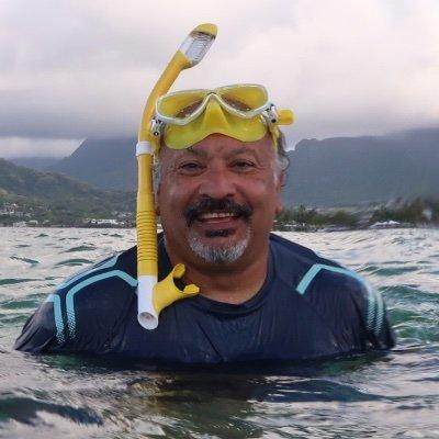 Debashish Bhattacharya in the water with snorkeling gear on