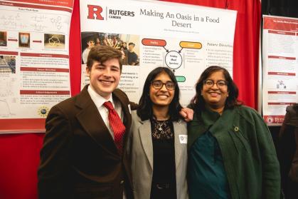 Computer science major Don Frenzel III (left) and biology and global studies major Rhea Sharma (center) with their project mentor Simanti Lahiri (right).