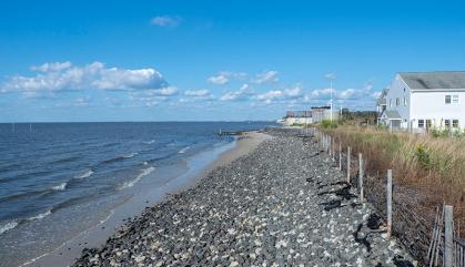 A berm of rocks facing the Delaware Bay