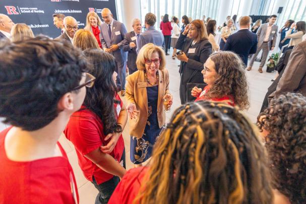 Dean Nickitas talks with nursing students and guests.